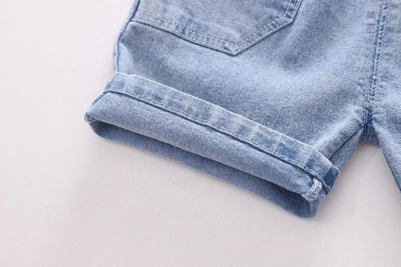 Stylish boys' 3D shark tail T-shirt paired with denim shorts by Ju Ju Jam