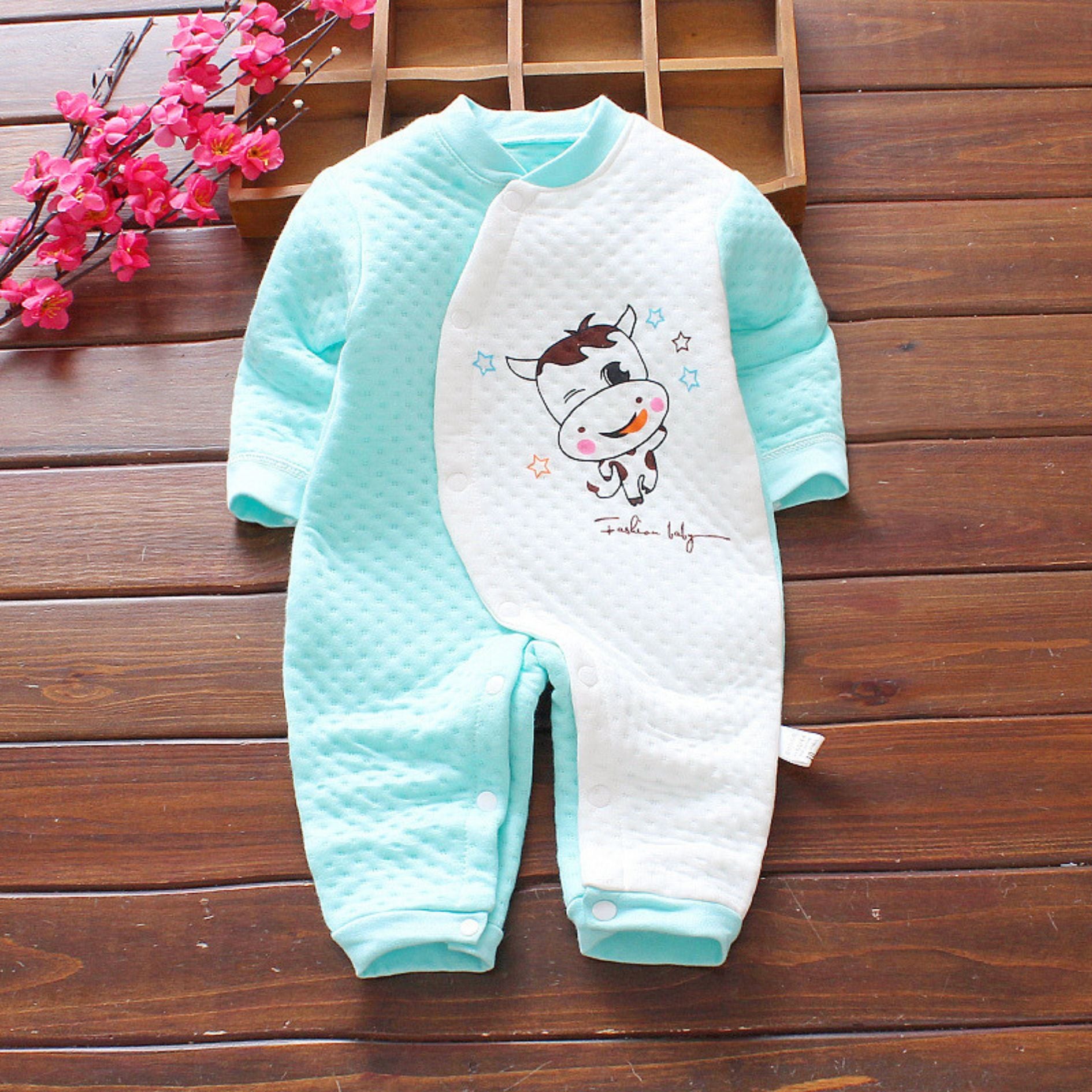 Moo Moo Patterned Baby Boys Girls Romper by Ju Ju Jam β Adorable unisex romper featuring a fun cow print, perfect for baby boys and girls.