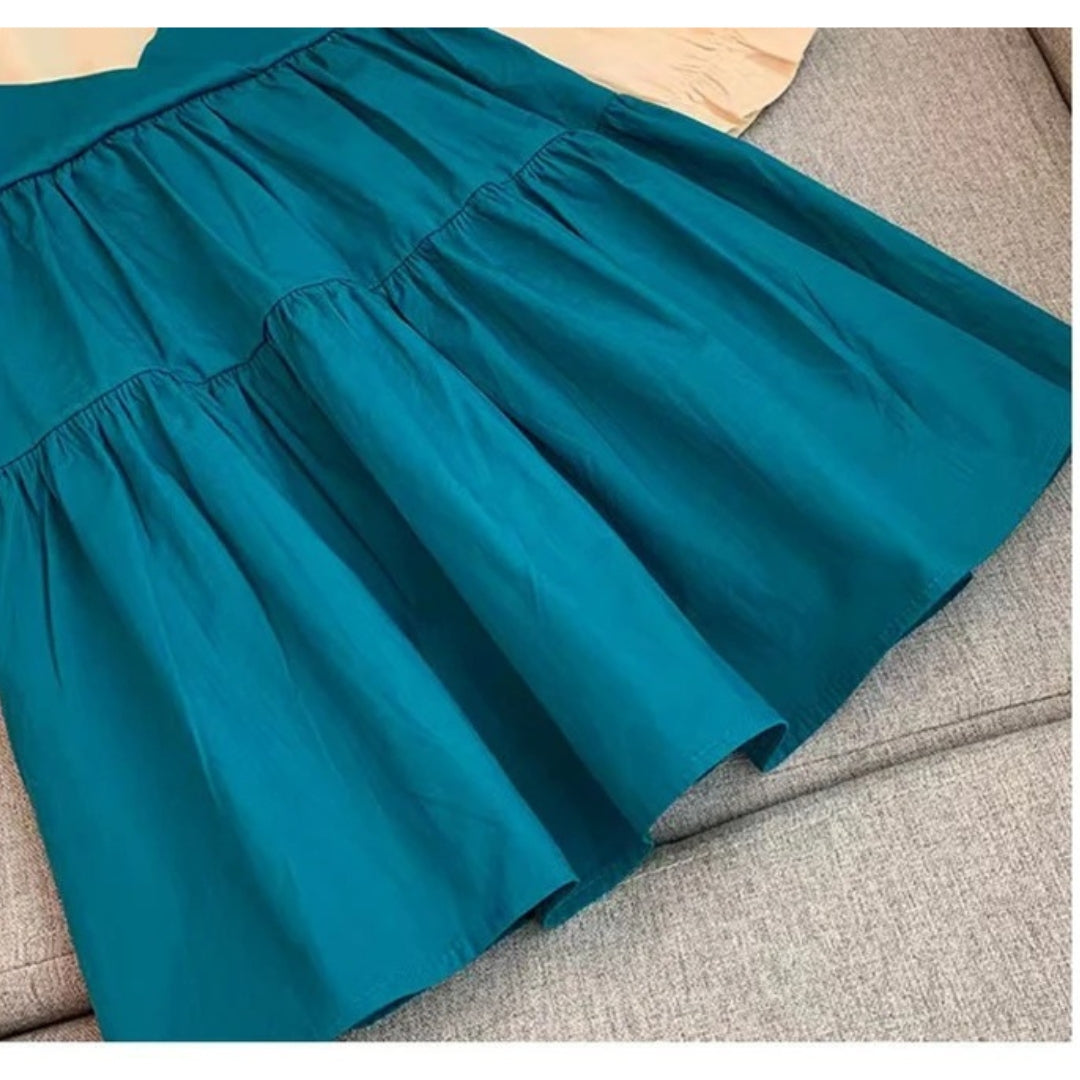 Fashionable baby girl wearing Ju Ju Jam denim dress with puffy sleeves