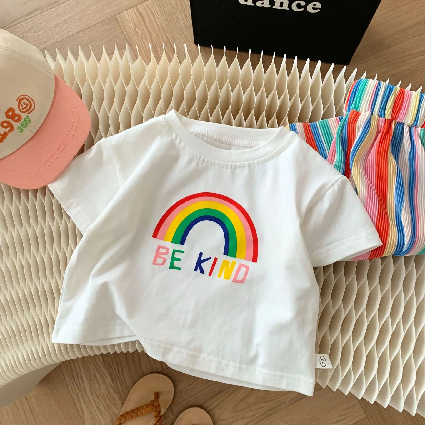 Front view of Be Kind Rainbow Set – fun and playful baby girl clothing by Ju Ju Jam