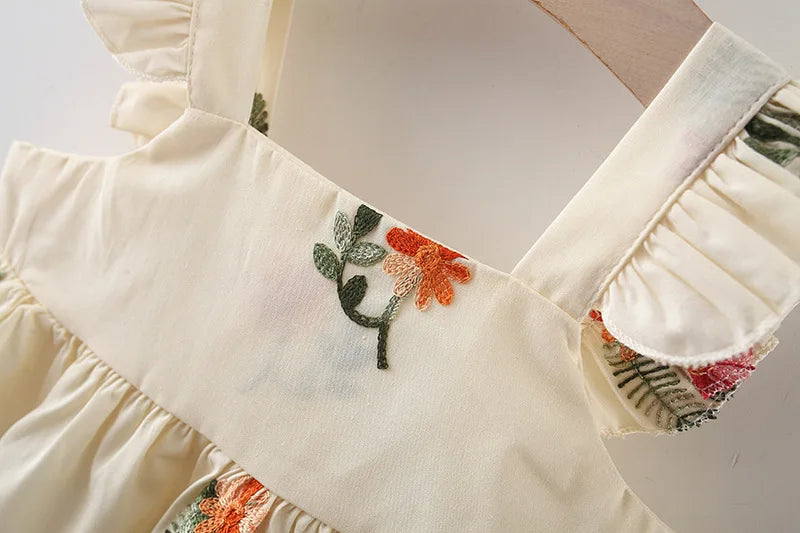 Elegant Blossom Girls Dress - Features intricate floral accents for a refined and classic look for baby girls, found at Ju Ju Jam.