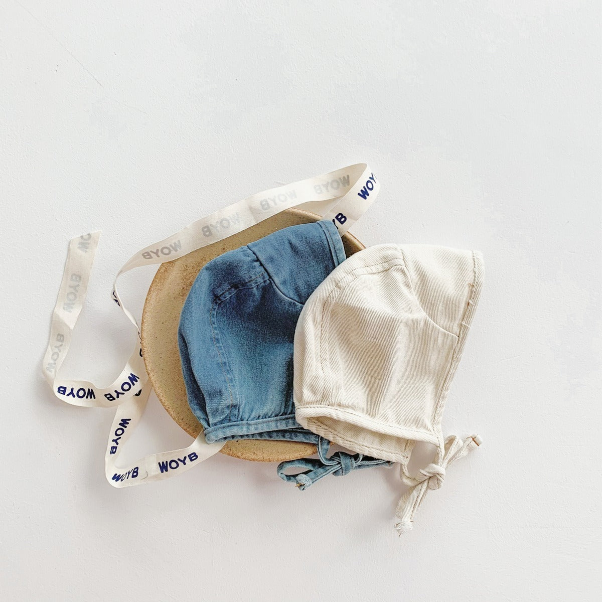 Ju Ju Jam denim babywear – soft and breathable romper with coordinating cap for babies.