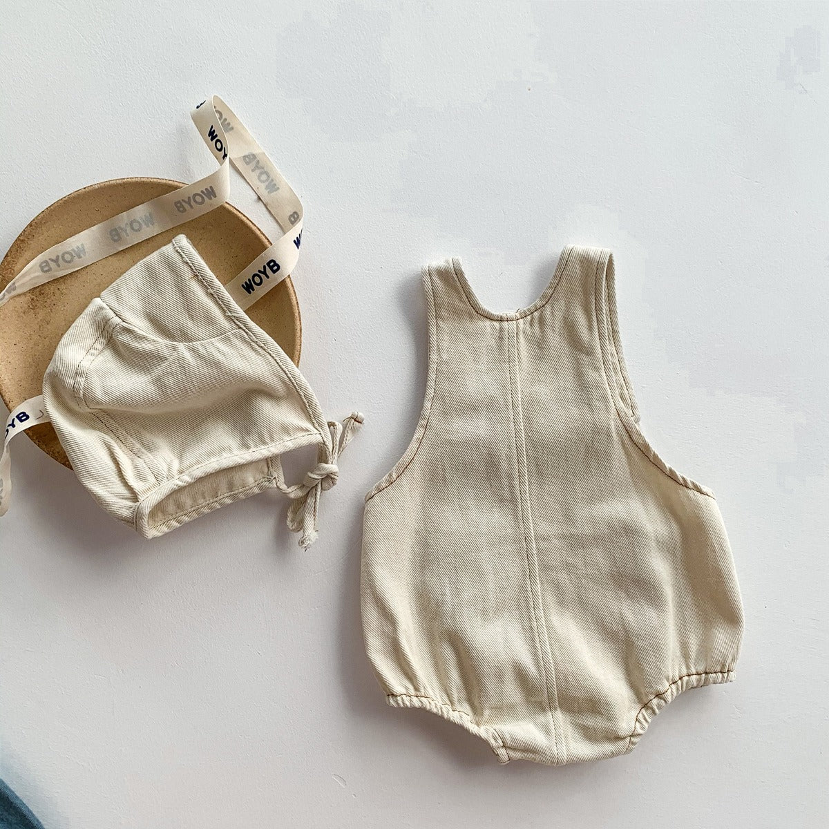 Unisex denim romper set with matching cap – trendy baby outfit for boys and girls by Ju Ju Jam.