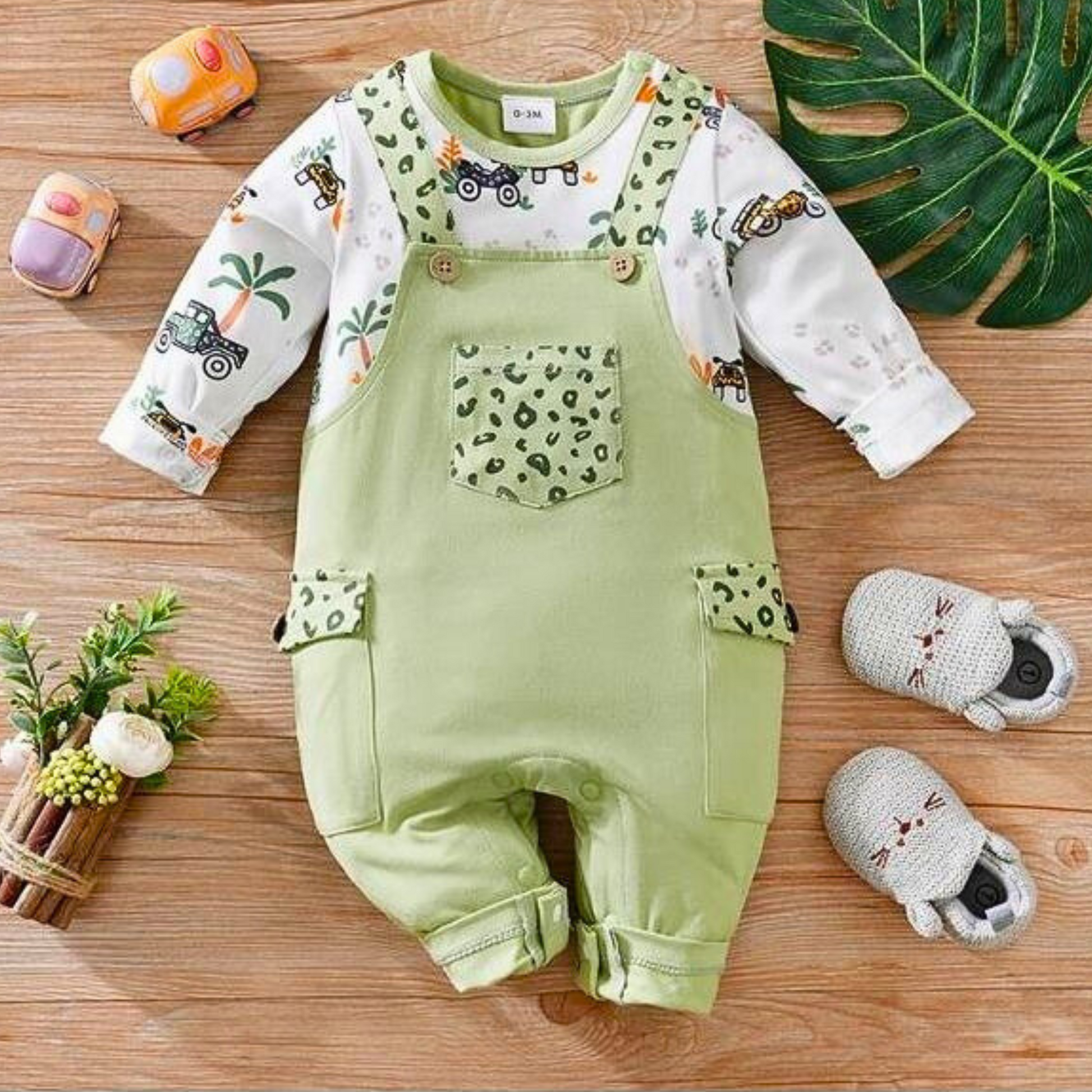 Baby wearing Green Vacation Romper by Ju Ju Jam