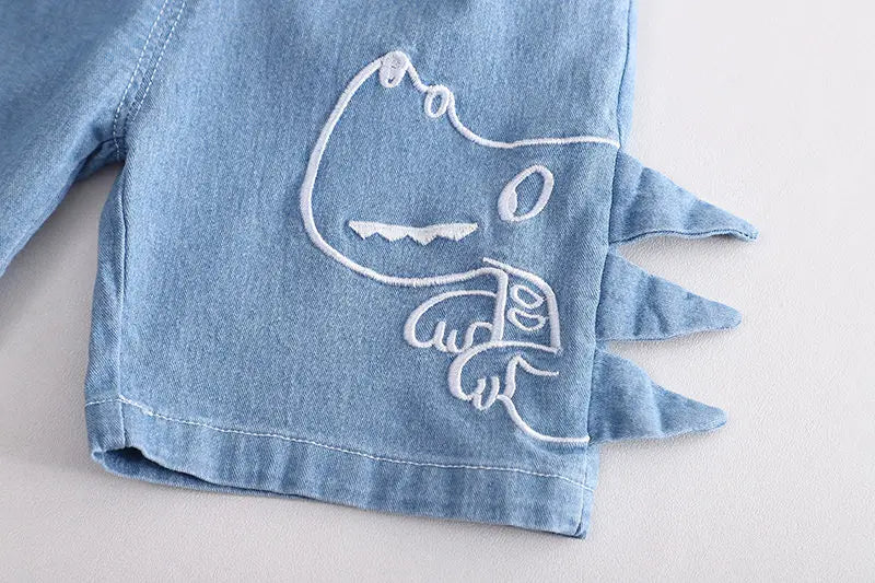 Happy child wearing Hey Dino Shorts with Bright T-shirt Boys Set by Ju Ju Jam