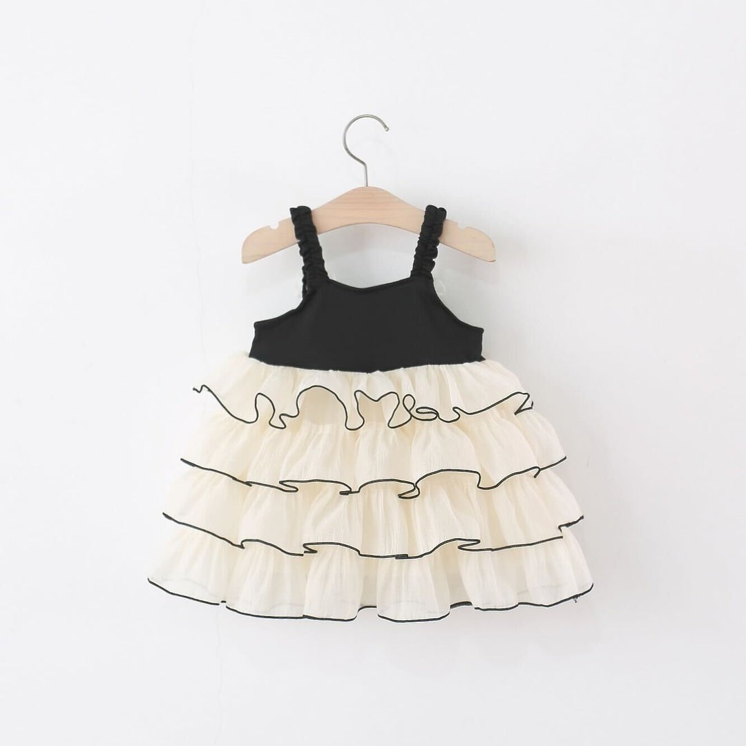 Chic black baby girl dress with frill detailing – Ju Ju Jam fashionable babywear.