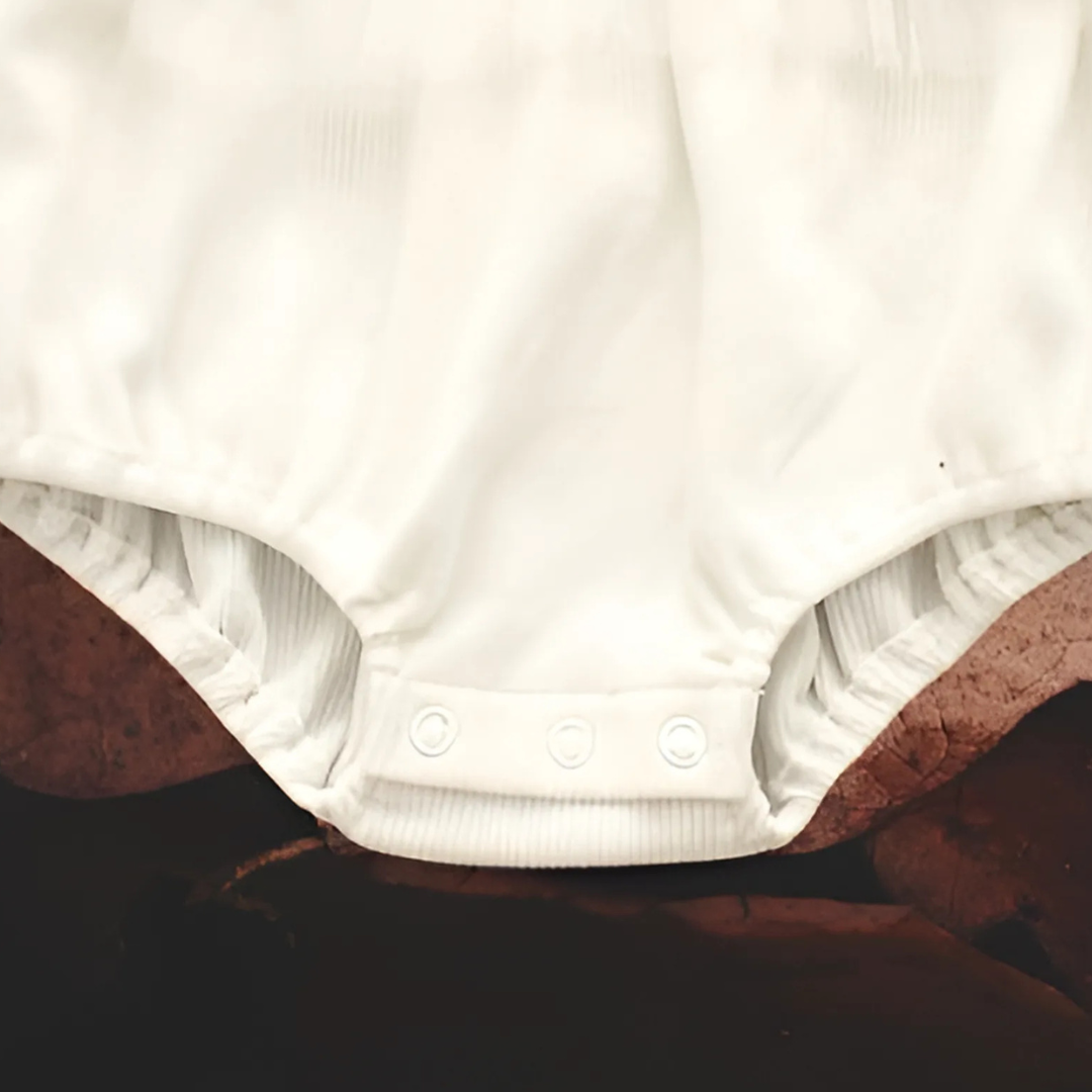 Frill romper for baby girls with cute bucket hat β Estella set by Ju Ju Jam for breezy and adorable style.