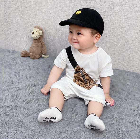 Travel Bag Printed Baby Romper by Ju Ju Jam - Cute romper for boys and girls featuring a fun travel bag print, perfect for little adventurers.