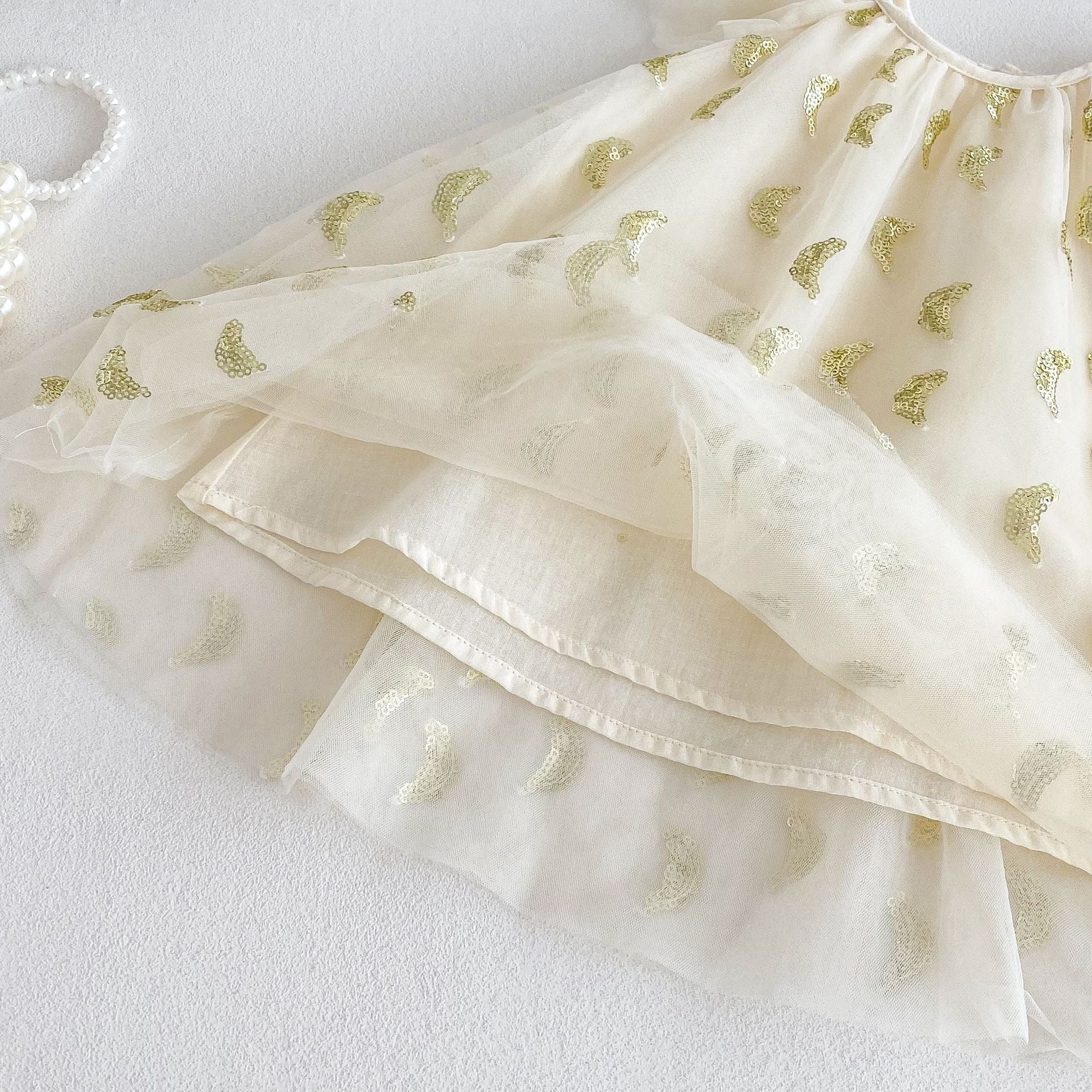 Close-up of Nyla Party Princess Dress – sequin detailing and soft, flowy fabric