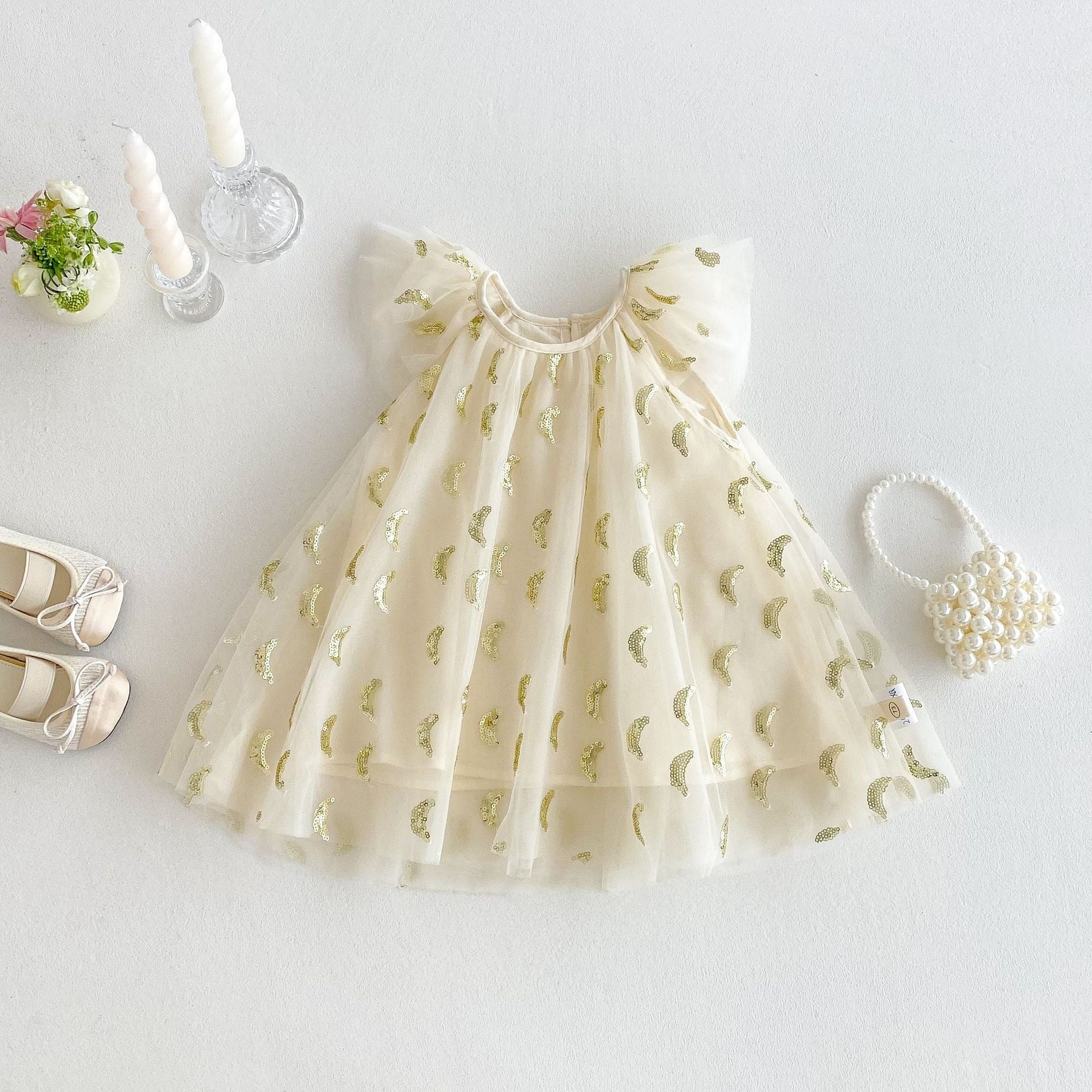 Back view of Nyla Party Princess Sequin Dress by Ju Ju Jam – bow tie detail and zipper closure