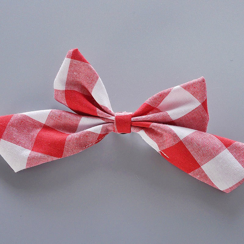 Close-up of ruffles and plaid fabric on Plaid Princess Romper Set