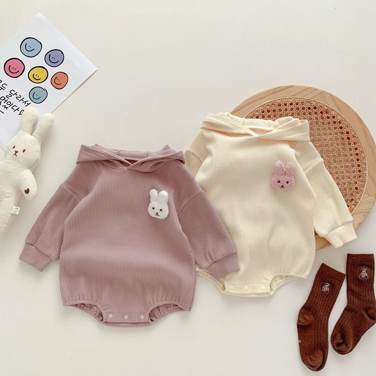 Rabbit tail baby romper with hood β gender-neutral onesie by Ju Ju Jam for infants and toddlers.