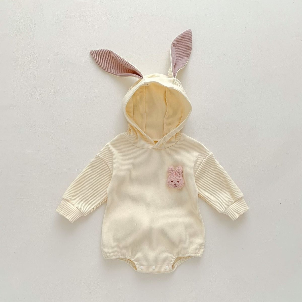 Unisex hooded onesie with rabbit detailing β perfect for baby photo shoots and cuddles from Ju Ju Jam.