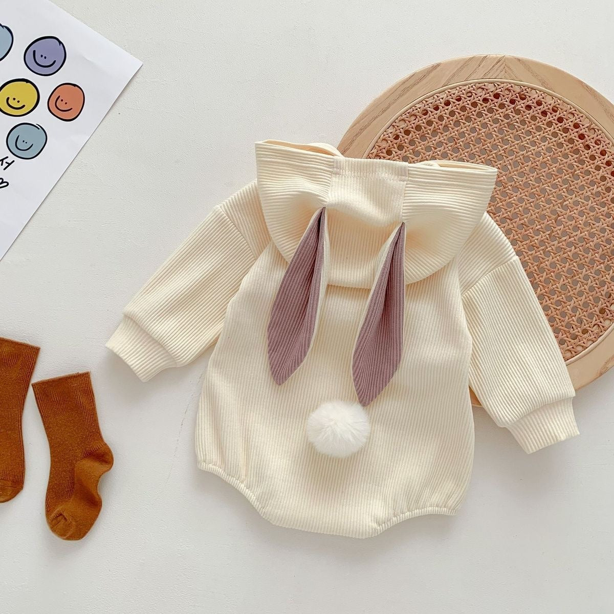 Hooded baby onesie with bunny tail β cute and cozy rabbit-style romper for boys and girls by Ju Ju Jam.