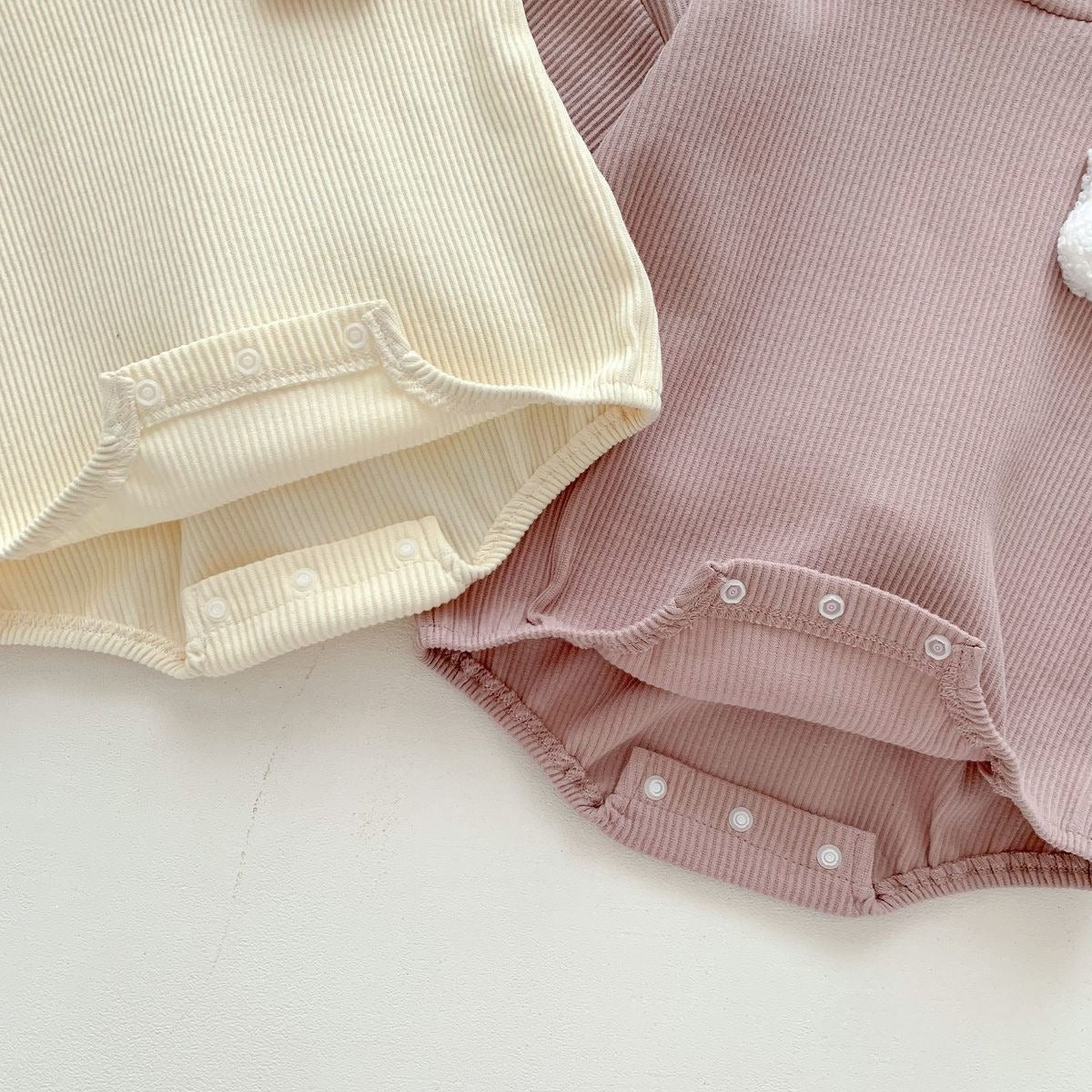 Ju Ju Jam unisex baby onesie β rabbit hood and fluffy tail design for extra cuteness and comfort.