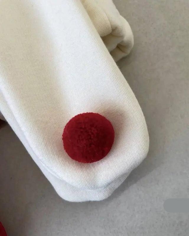 Santa-inspired romper with matching cap for baby girls and boys, holiday collection by Ju Ju Jam.