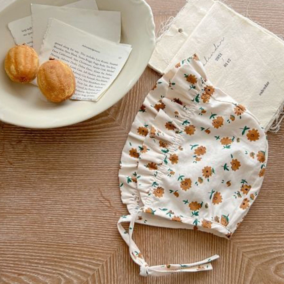 Elegant baby girl romper with frills and cap – Stella outfit from Ju Ju Jam kids fashion collection.