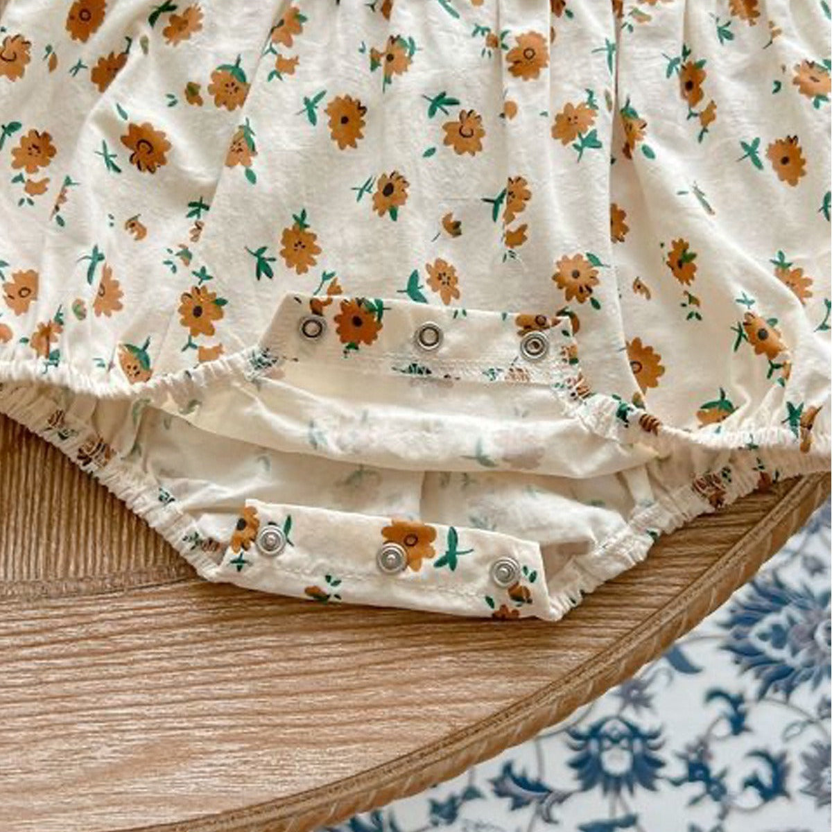 Charming Stella romper with frill details and cap – baby girls' designer wear by Ju Ju Jam.