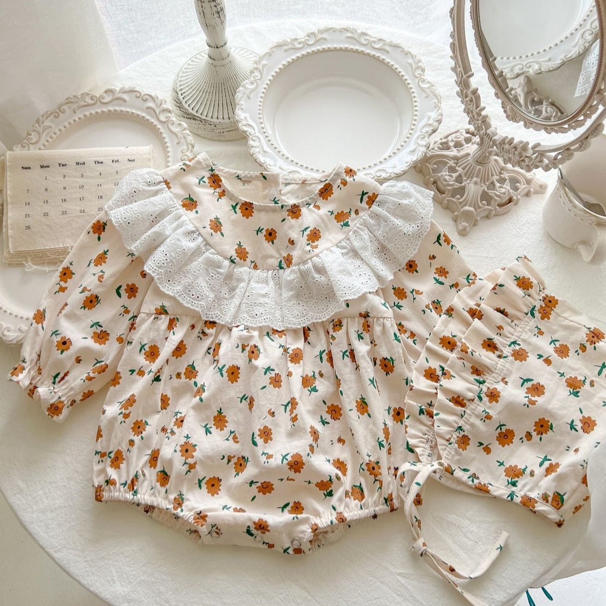 Adorable Stella baby girl romper with frilly design and cap – premium baby clothing by Ju Ju Jam.