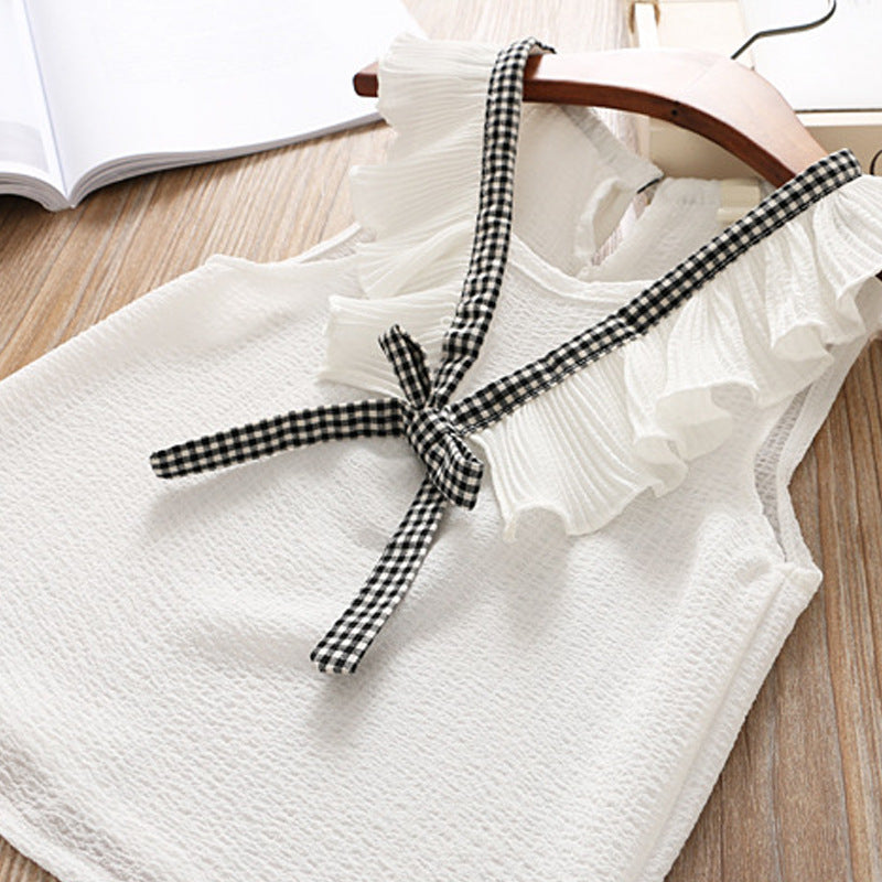 Ju Ju Jam girl's two-piece plaid set, featuring a stylish plaid design with a coordinating top and bottoms for a fashionable and coordinated look.