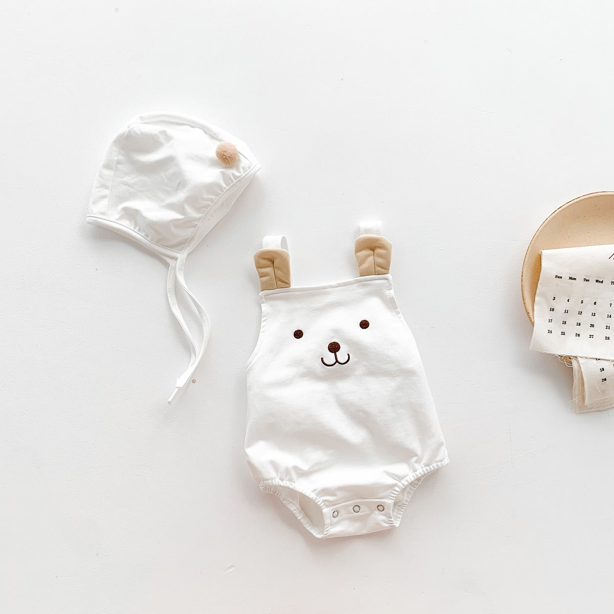 Baby in Tiny Teddy Romper With Hat by Ju Ju Jam – adorable bear-themed outfit