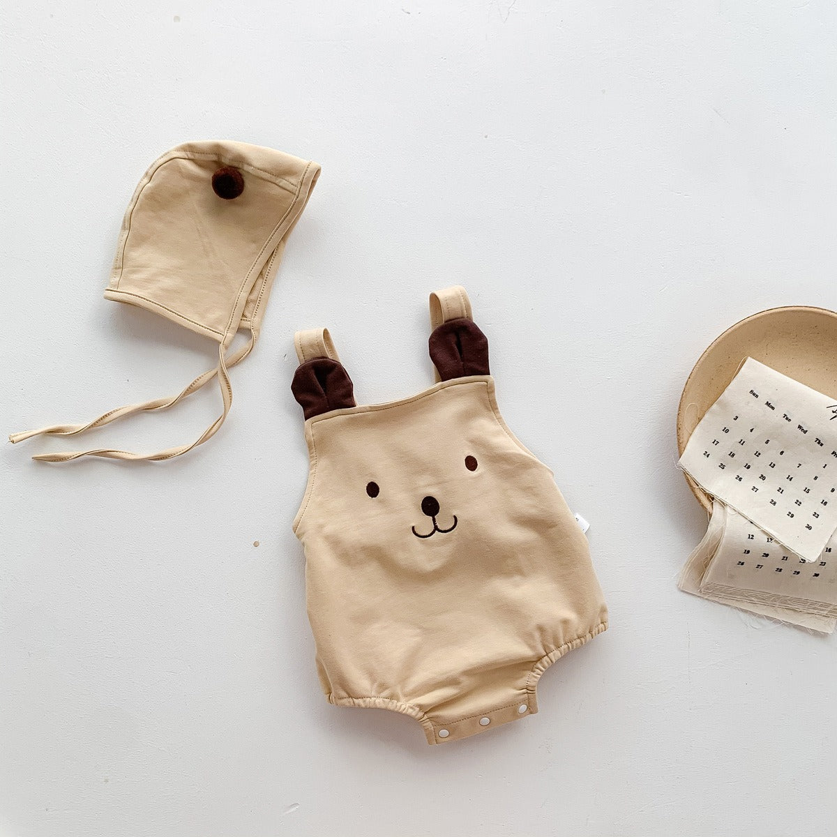 Front view of Tiny Teddy Romper With Hat – cozy romper with matching teddy bear hat