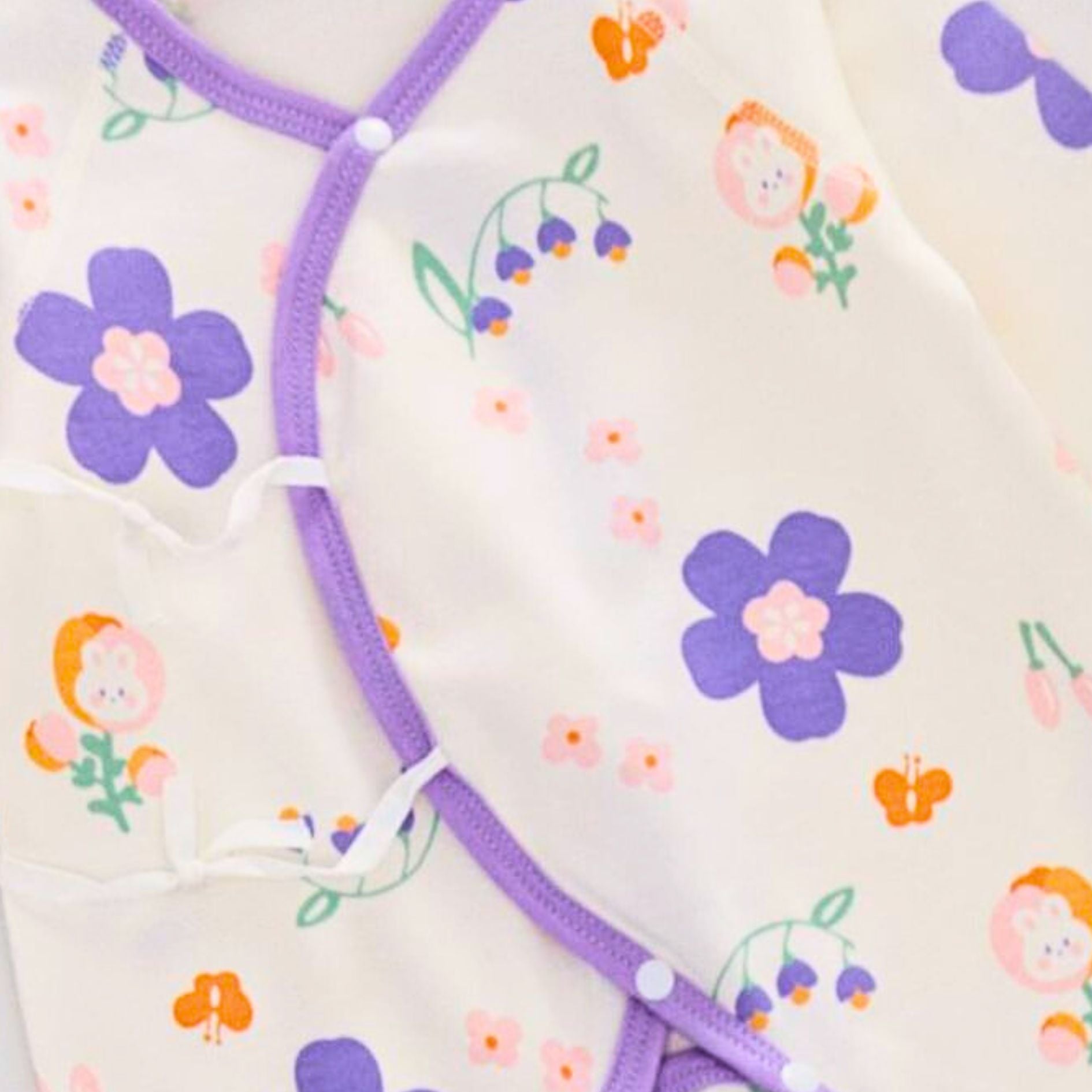 Lavender Baby Girls Romper with floral bloom design by Ju Ju Jam, designed for comfort and style in a soft, breathable fabric.