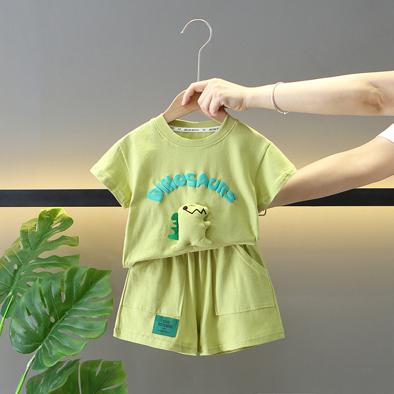 Boys' 3D Dinosaur green outfit from Ju Ju Jam, including a green shirt with a fun 3D dinosaur design and coordinating shorts.