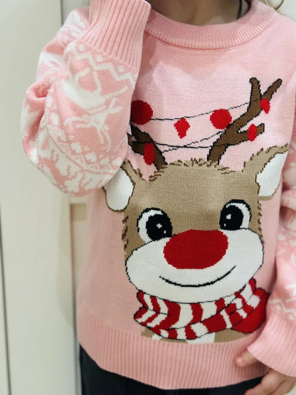 Children playing in the snow while wearing the Charming Girls Cozy Reindeer Sweater, adding warmth and holiday spirit.