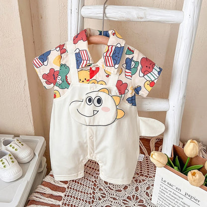 Baby in Baby Jurassic Joy Romper by Ju Ju Jam – fun dinosaur-themed baby outfit

