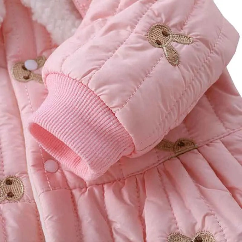 Soft and cozy puffer romper in pink for baby girls, highlighted by a sweet bunny sling detail, by Ju Ju Jam.