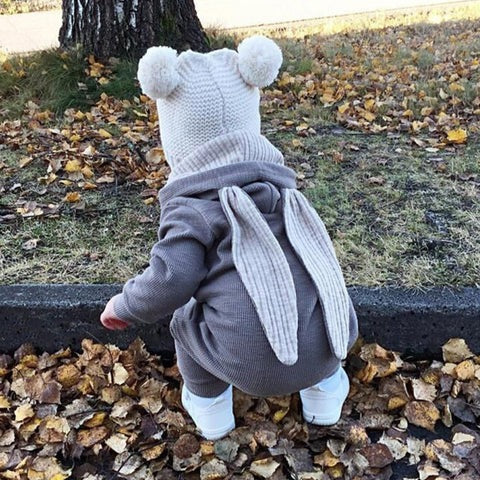 Cute bunny-themed baby romper jumpsuit by Ju Ju Jam – hooded design with floppy ears for boys and girls.

