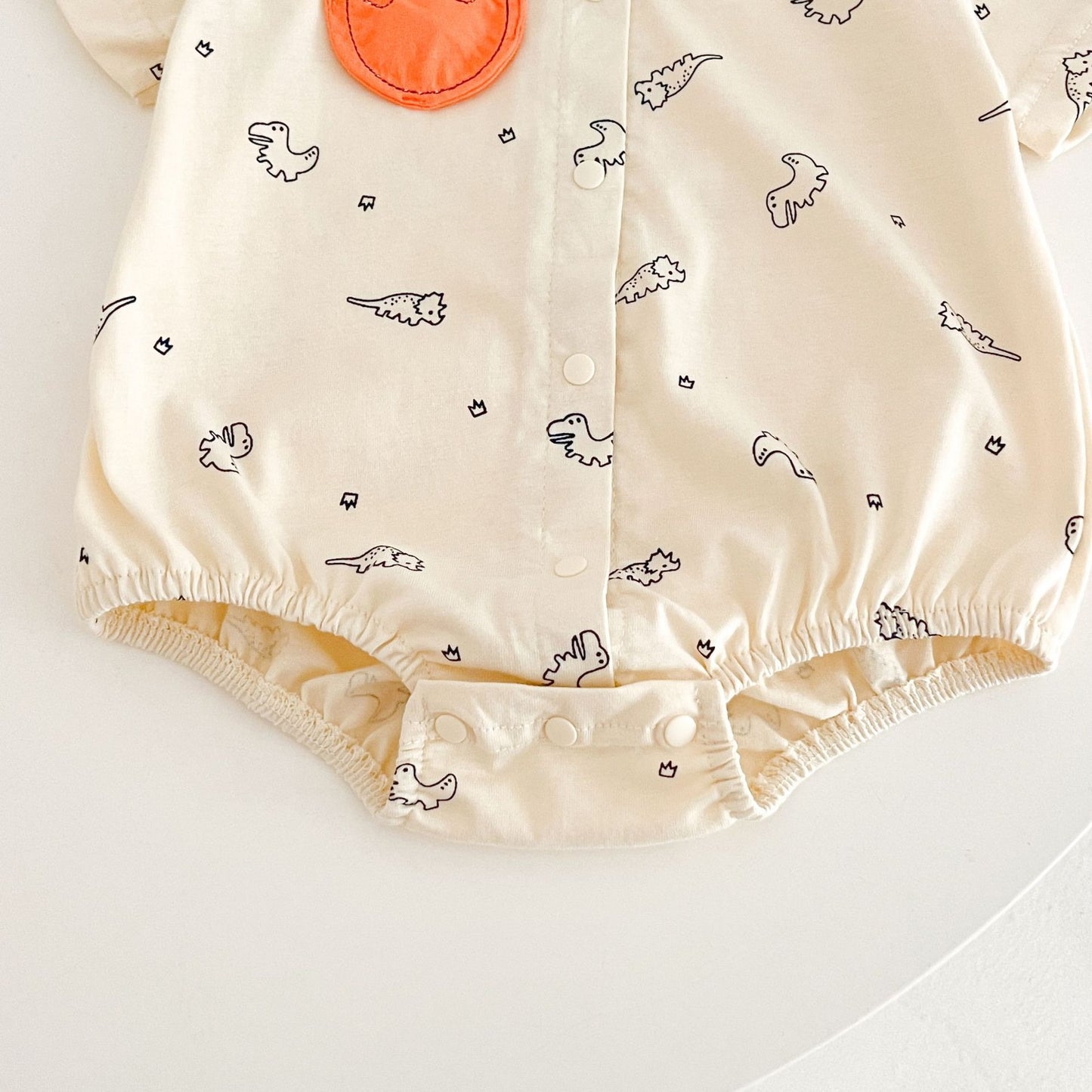 Ju Ju Jam Comfy Dino romper – dinosaur-themed baby shirt romper for boys.

