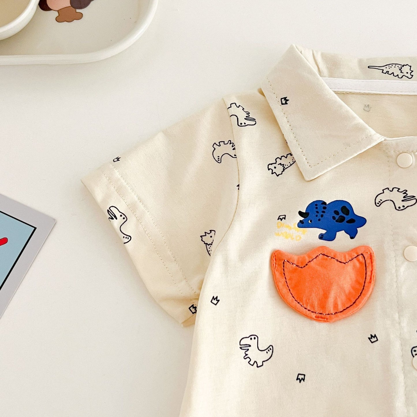 Adorable dino romper shirt – comfy and lightweight baby boys outfit from Ju Ju Jam.

