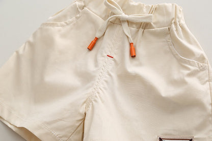 Ju Ju Jam boys' set featuring a T-shirt with contrast green neck and matching shorts