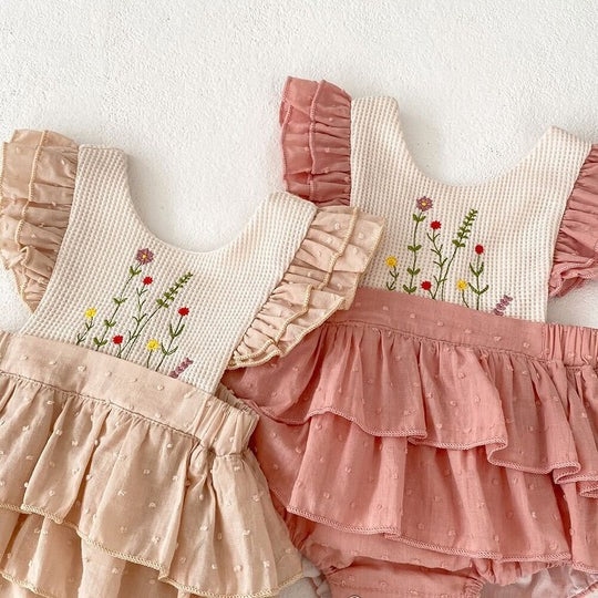 Baby girl in Elina Soft Ruffle Romper Dress – adorable outfit from Ju Ju Jam

