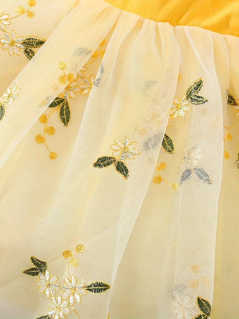 Close-up of embroidered design on girls' yellow dress - Ju Ju Jam