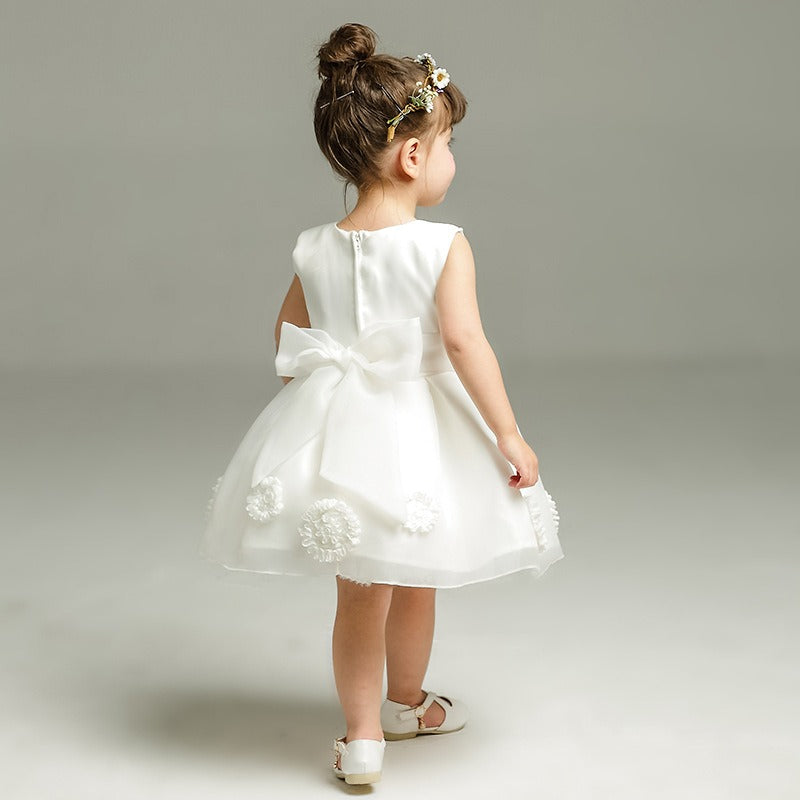 Baby girl dressed in Ju Ju Jam Evelyn ball gown for party


