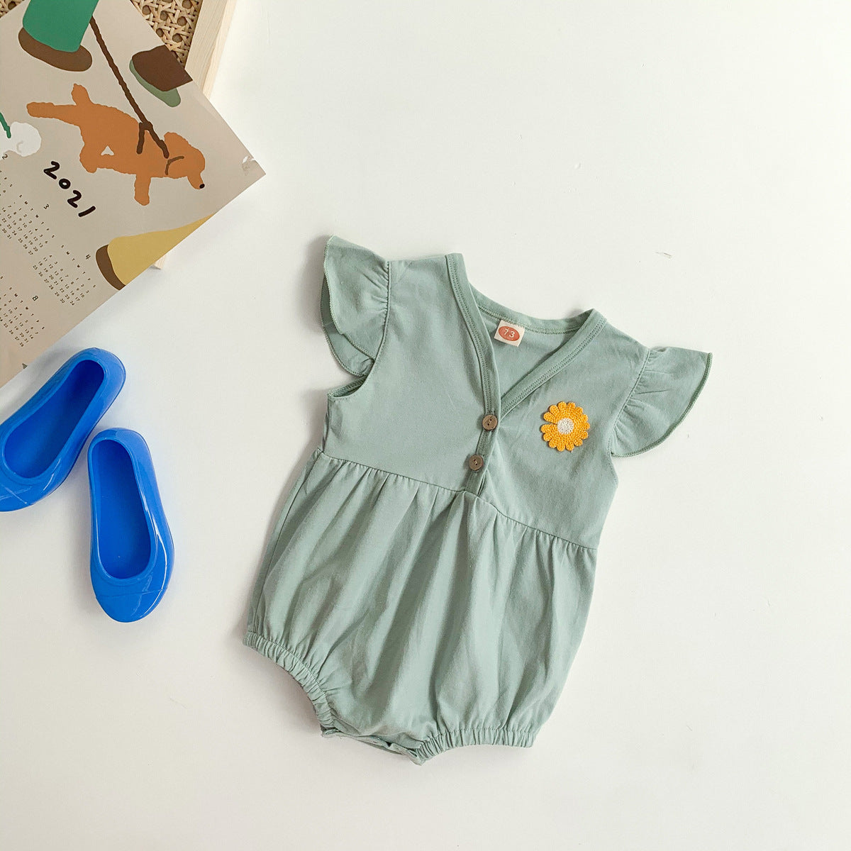 Everyday Flower Romper for Baby Girls by Ju Ju Jam - Soft and stylish romper with a floral pattern for a playful look.