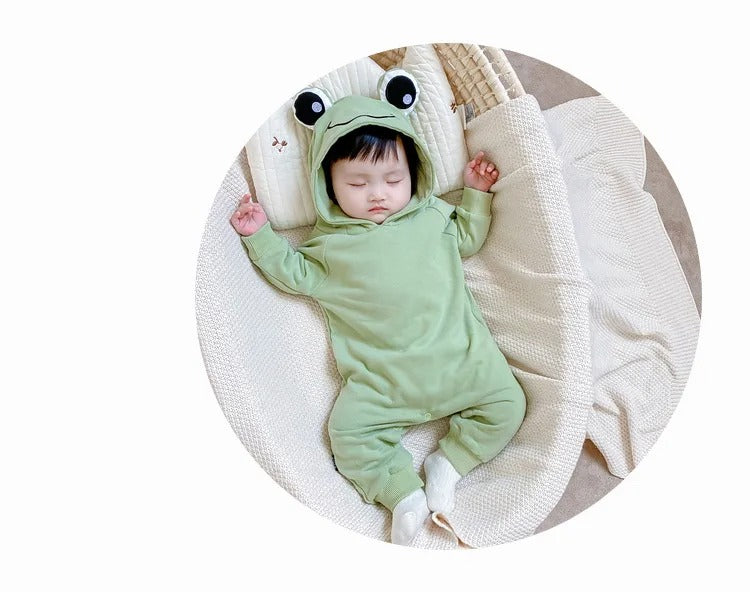 Adorable infant in a Frog Eyes hooded onesie, designed for a cute and comfy look from Ju Ju Jam.