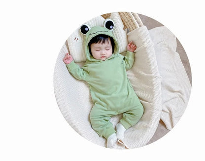 Adorable infant in a Frog Eyes hooded onesie, designed for a cute and comfy look from Ju Ju Jam.