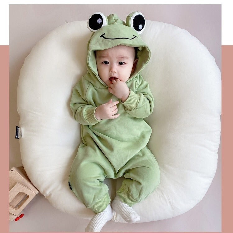 Sweet baby in a Frog Eyes hooded onesie, designed for comfort and style from Ju Ju Jam."