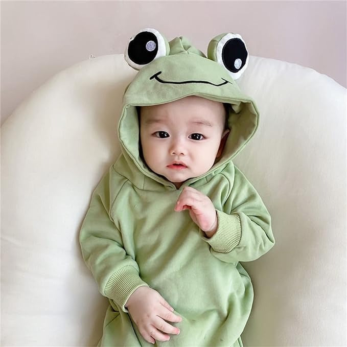 Baby boy and girl in a whimsical Frog Eyes hooded onesie with frog eye details from Ju Ju Jam.