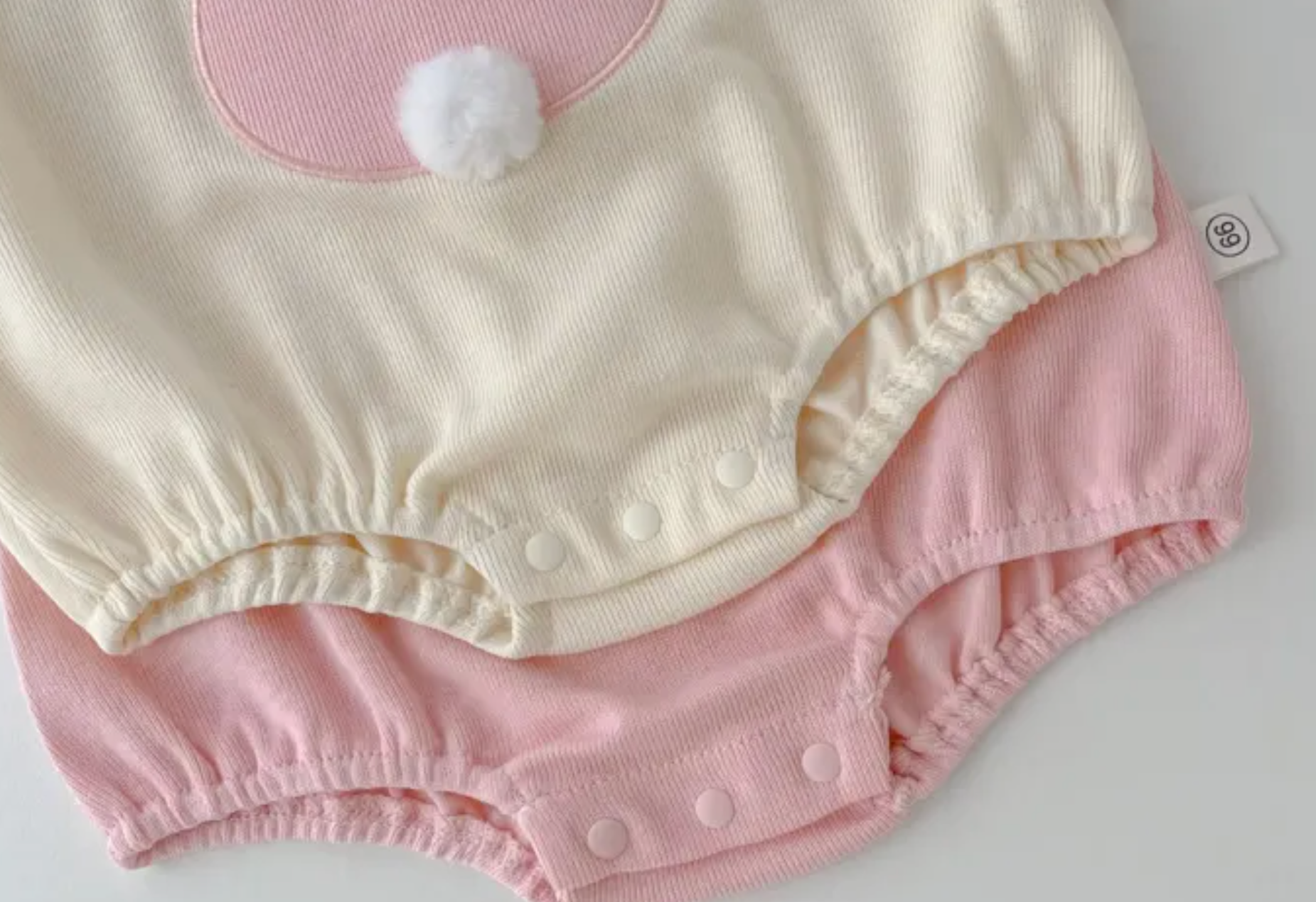 Baby girl smiling in Gia Bunny Ears romper outfit – Ju Ju Jam spring collection

