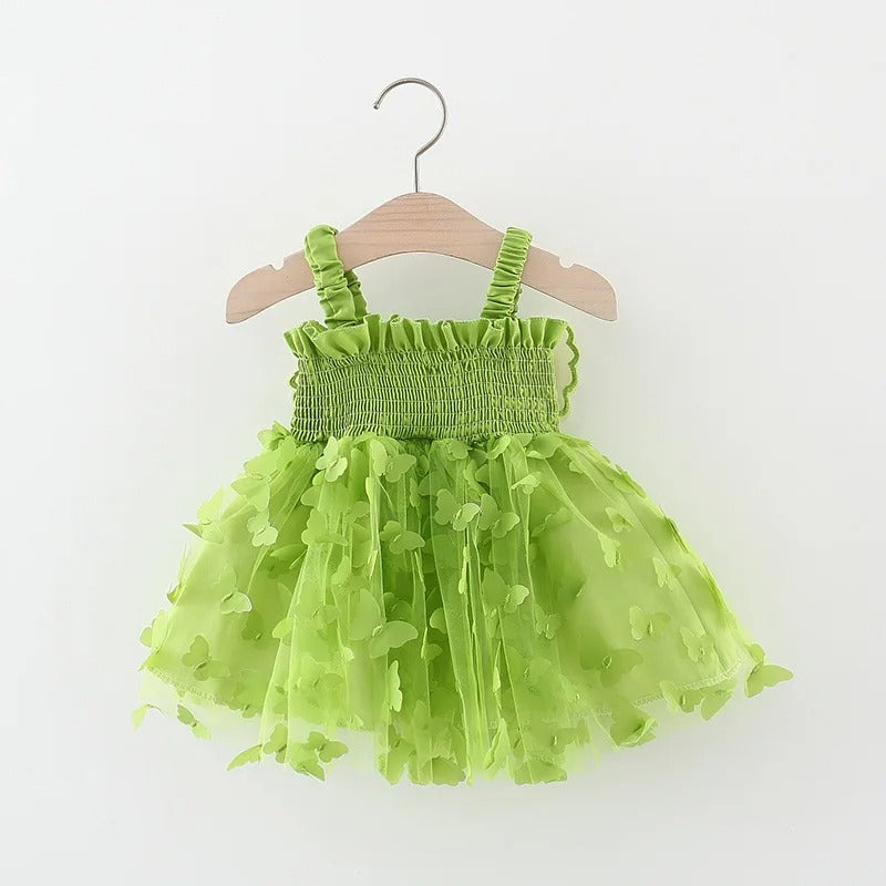 Close-up of butterfly wings design on green girls' party dress - Ju Ju Jam