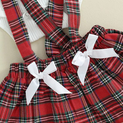 Plaid Charm romper for baby girls, featuring a cute matching bow, designed for comfort and style by Ju Ju Jam.