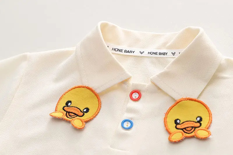 Cozy baby jumpsuit featuring a hanging duck design, perfect for boys and girls from Ju Ju Jam.