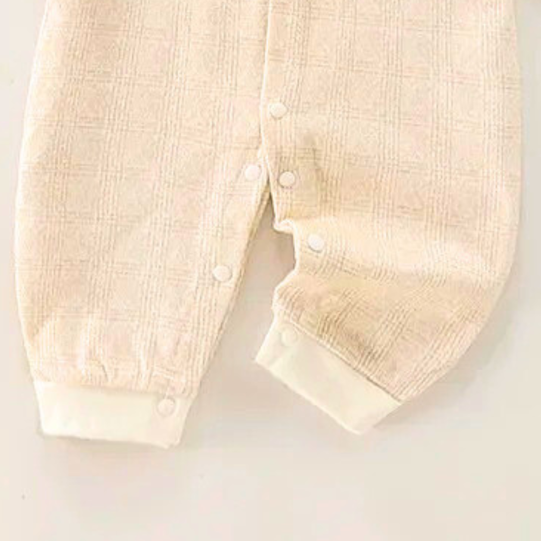 Snuggle-ready baby romper with bow – Happy Baby outfit for boys and girls from Ju Ju Jam.

