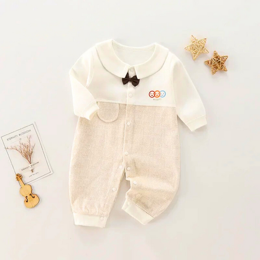 Happy baby romper with bow for boys and girls – cozy and cute snuggle outfit by Ju Ju Jam.

