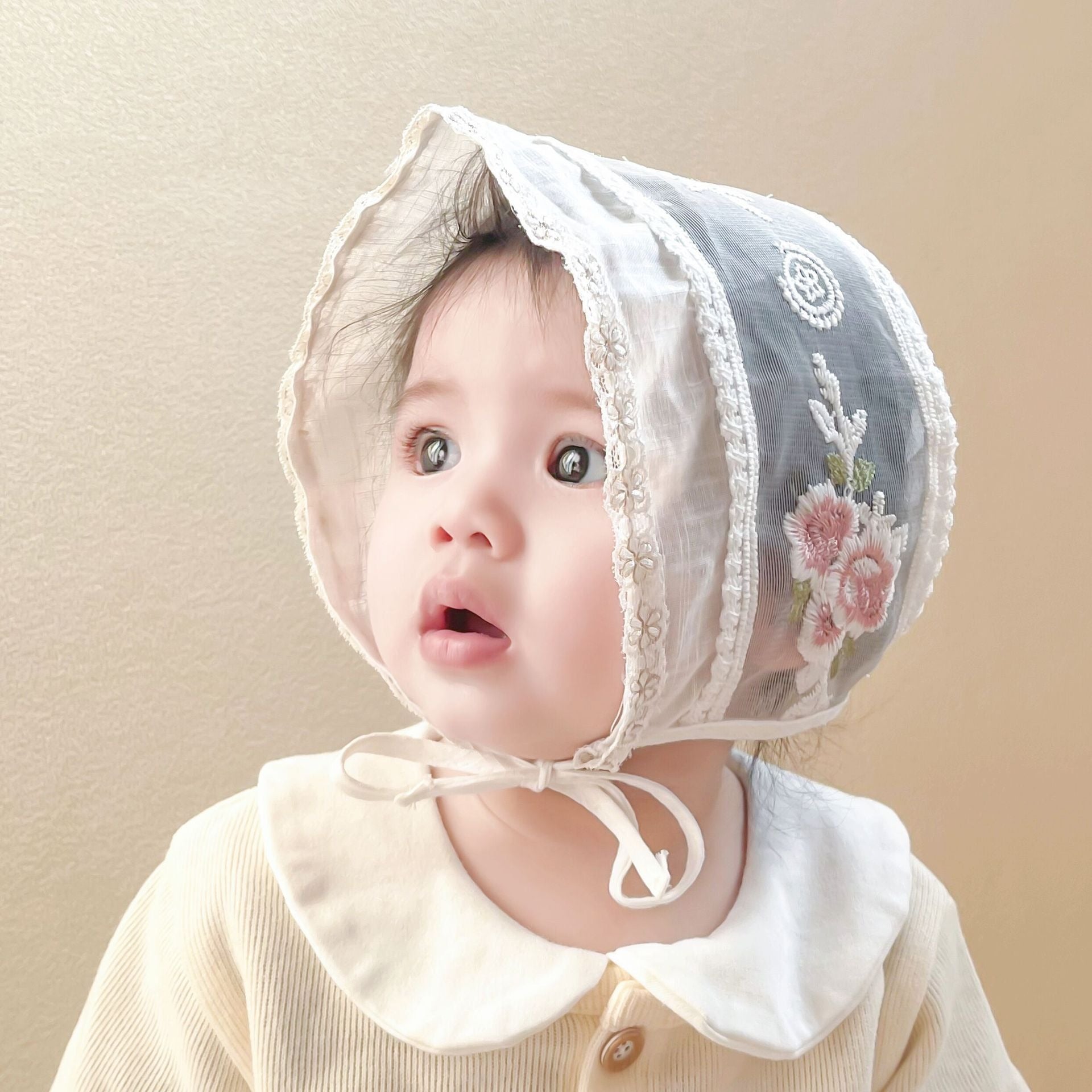 Ju Ju Jam Ivory Embroidered Baby Girls Cap – elegant cotton cap with delicate floral embroidery.

